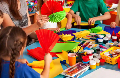 Kids with crafts spread on the table